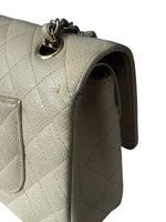 Load image into Gallery viewer, Close-up of a beige quilted handbag with a gold chain detail on a white background
