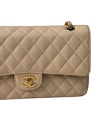 Load image into Gallery viewer, Beige quilted handbag with gold hardware on a white background
