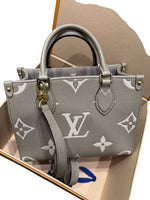 Load image into Gallery viewer, Louis Vuitton Onthego PM Dove/Cream Bicolor Monogram Empreinte Gold-tone Hardware
