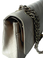 Load image into Gallery viewer, Close-up of a beige handbag with a chain strap on a white background
