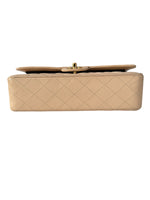 Load image into Gallery viewer, Beige quilted handbag on a white background
