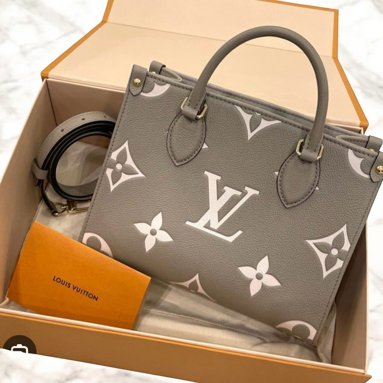 Louis Vuitton Onthego PM Dove/Cream Bicolor Monogram Empreinte Gold-tone Hardware