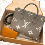 Load image into Gallery viewer, Louis Vuitton Onthego PM Dove/Cream Bicolor Monogram Empreinte Gold-tone Hardware
