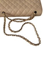 Load image into Gallery viewer, Beige quilted handbag with a gold chain strap on a white background
