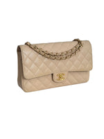 Load image into Gallery viewer, Beige quilted handbag with gold chain and clasp on a white background
