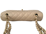 Load image into Gallery viewer, Beige quilted handbag with gold chain strap on a white background
