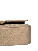 Load image into Gallery viewer, Close-up of a beige quilted handbag on a white background
