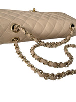 Load image into Gallery viewer, Beige quilted handbag with gold chain strap on a white background
