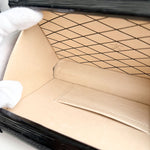 将图片加载到图库查看器，Close-up of a beige leather-bound book with black grid pattern on cover
