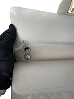 Load image into Gallery viewer, Close-up of a white textured handbag with a gold logo on a white background
