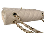 Load image into Gallery viewer, Beige quilted handbag with gold chain strap on a white background
