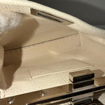 将图片加载到图库查看器，Close-up of a textured surface with metallic accents
