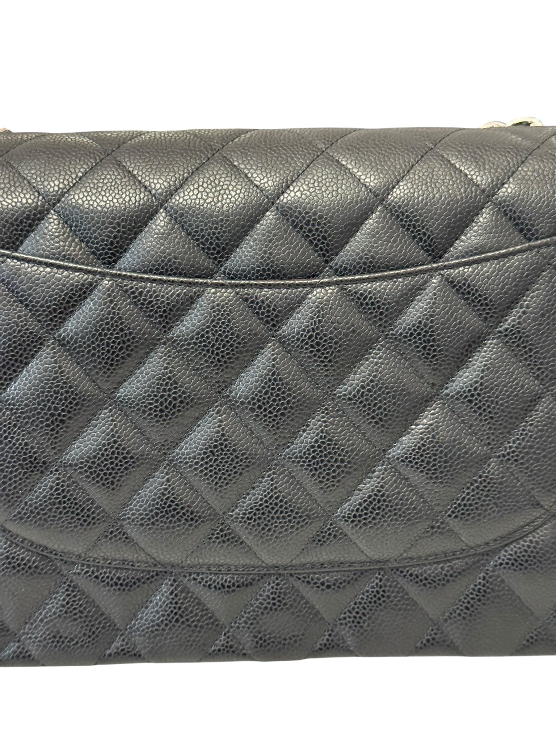 Quilted gray handbag on a white background