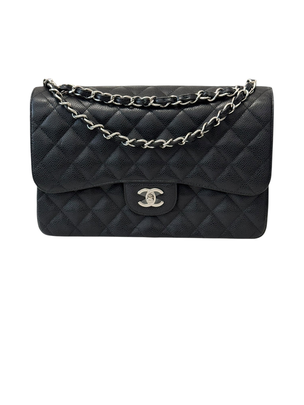 Black quilted handbag with silver chain on a white background