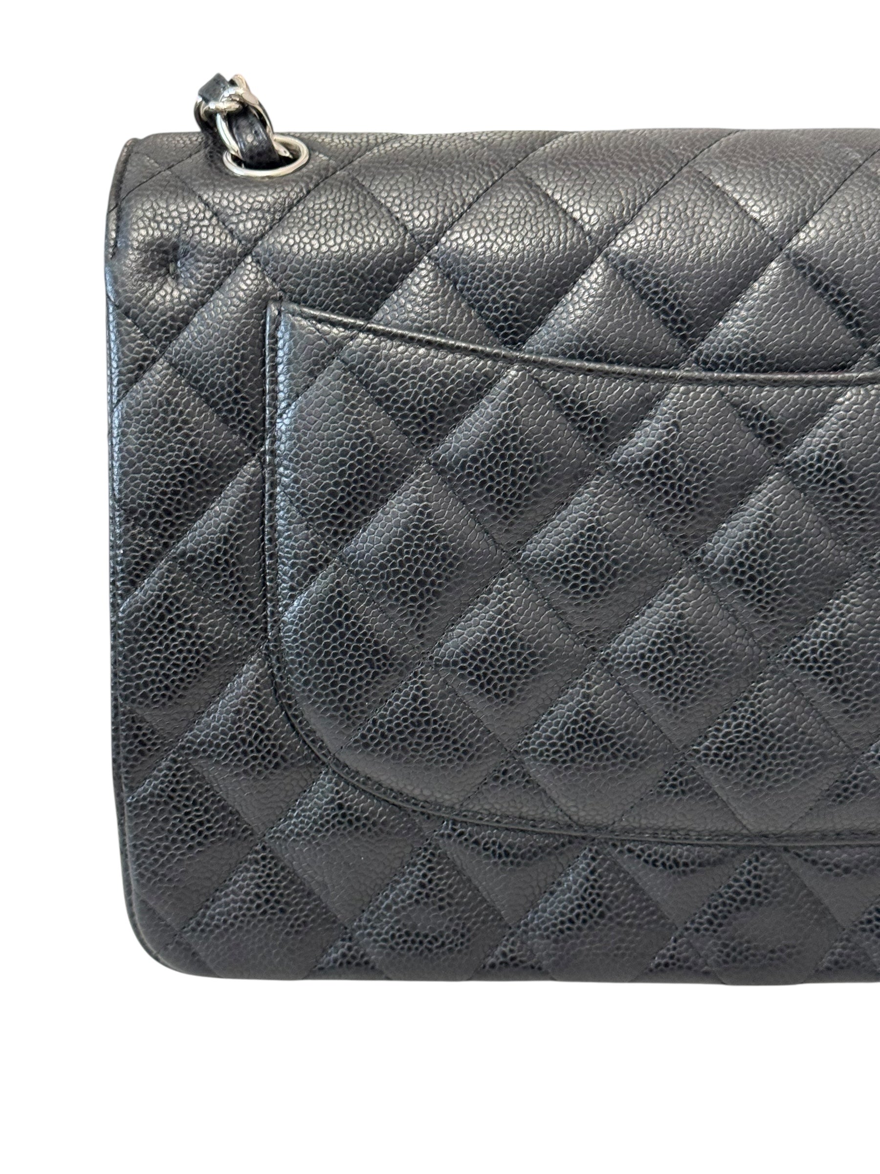 Quilted gray handbag on a white background