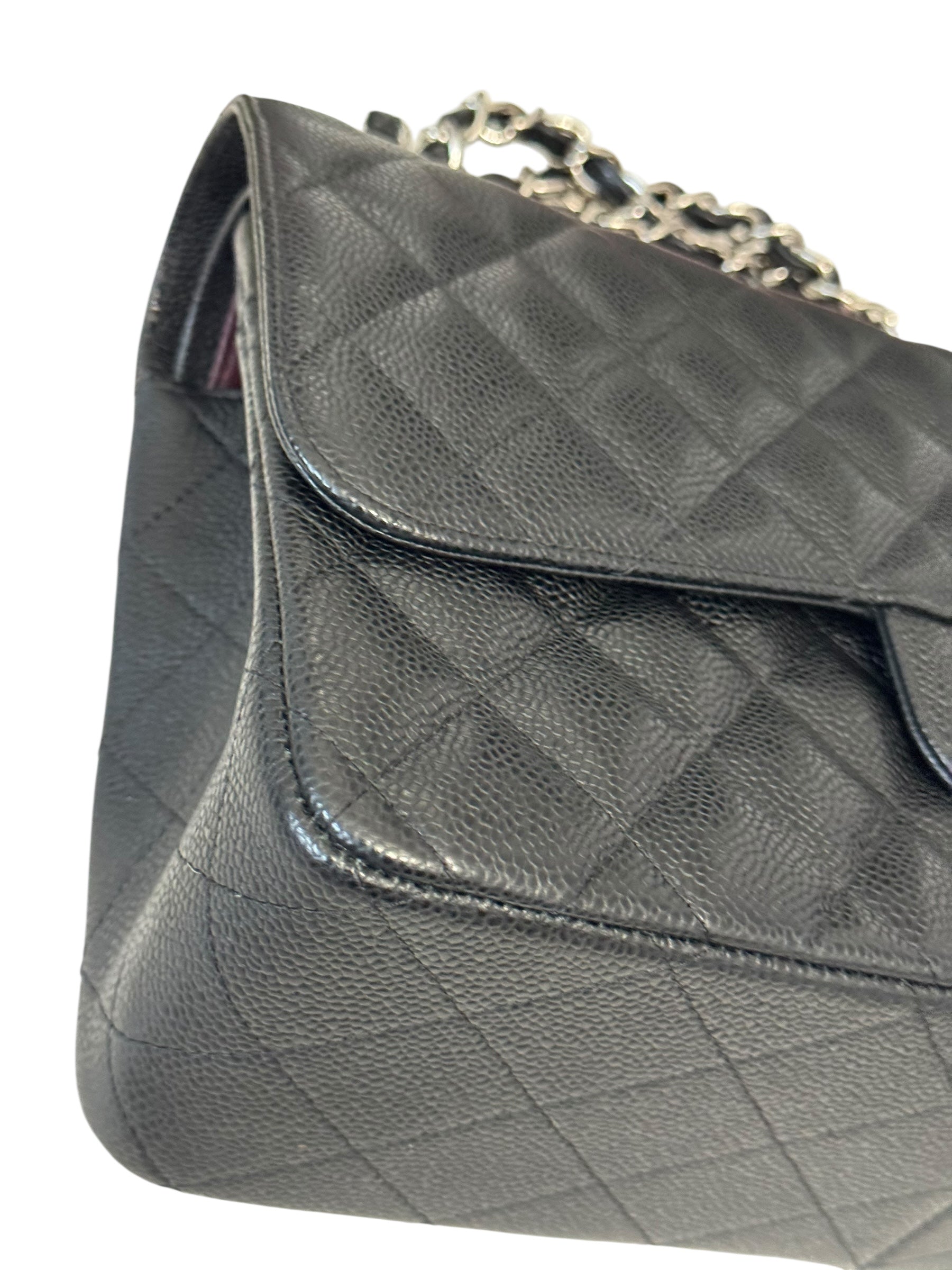 Quilted gray handbag with a chain strap on a white background