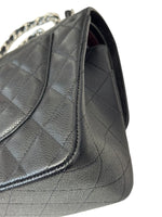 将图片加载到图库查看器，Black quilted handbag on a white background
