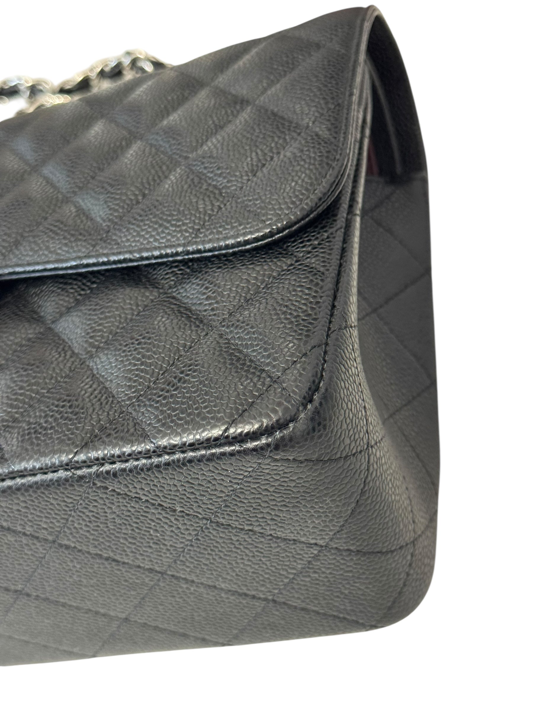 Quilted gray handbag on a white background