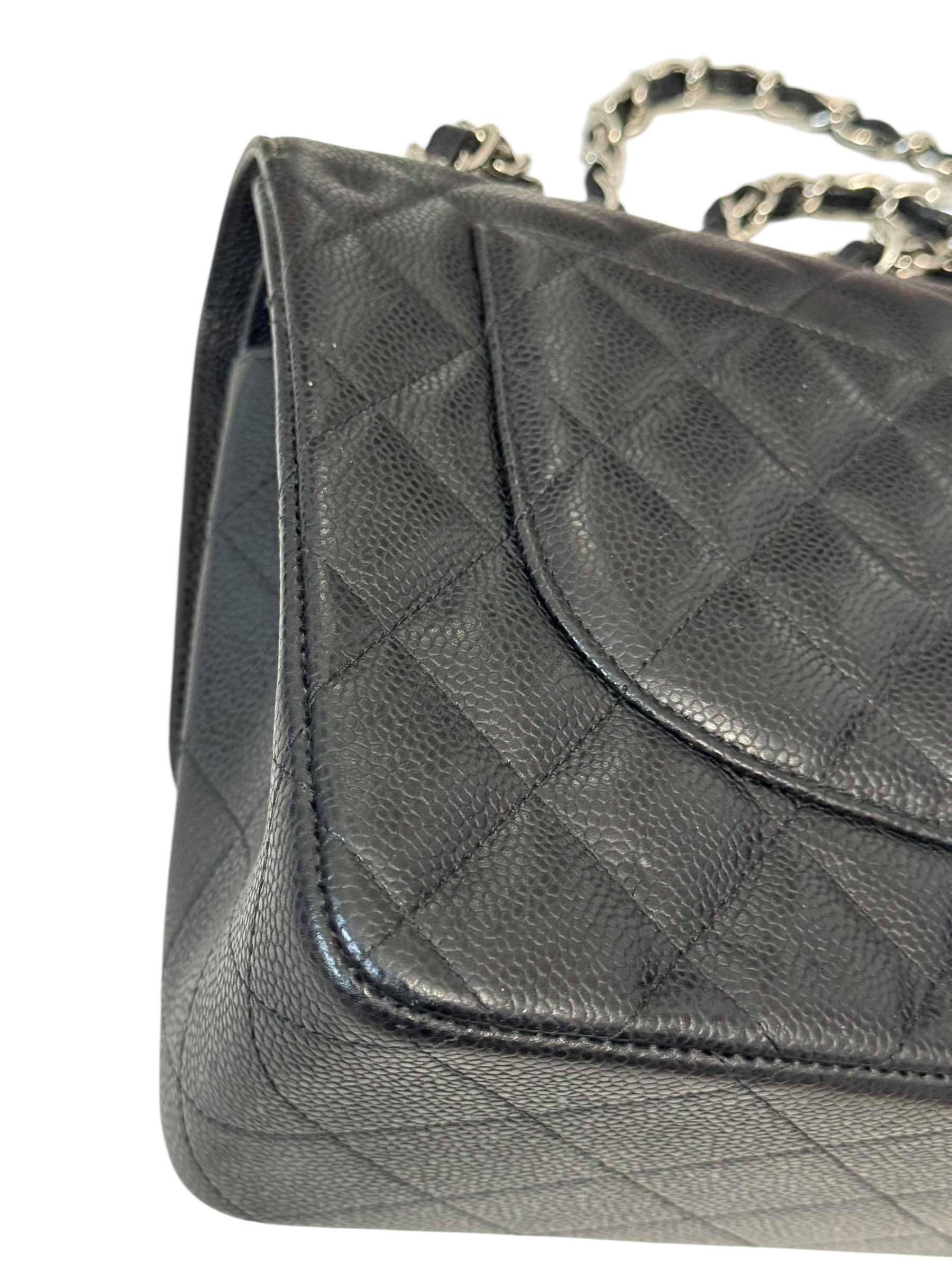 Quilted gray handbag with a chain strap on a white background
