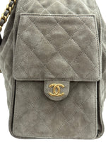 将图片加载到图库查看器，Gray quilted handbag with gold Chanel logo on a white background
