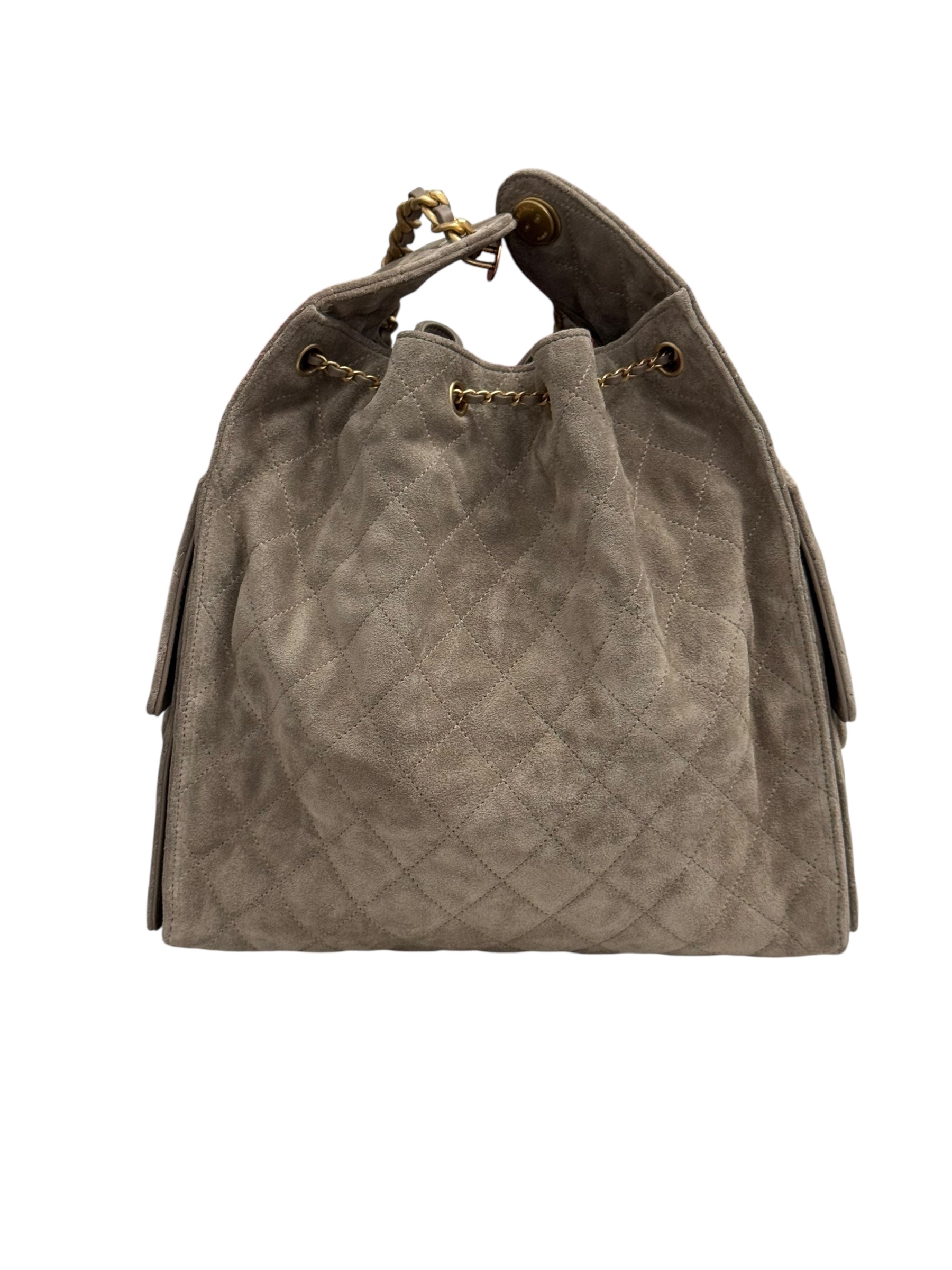 Gray suede handbag with drawstring on a white background