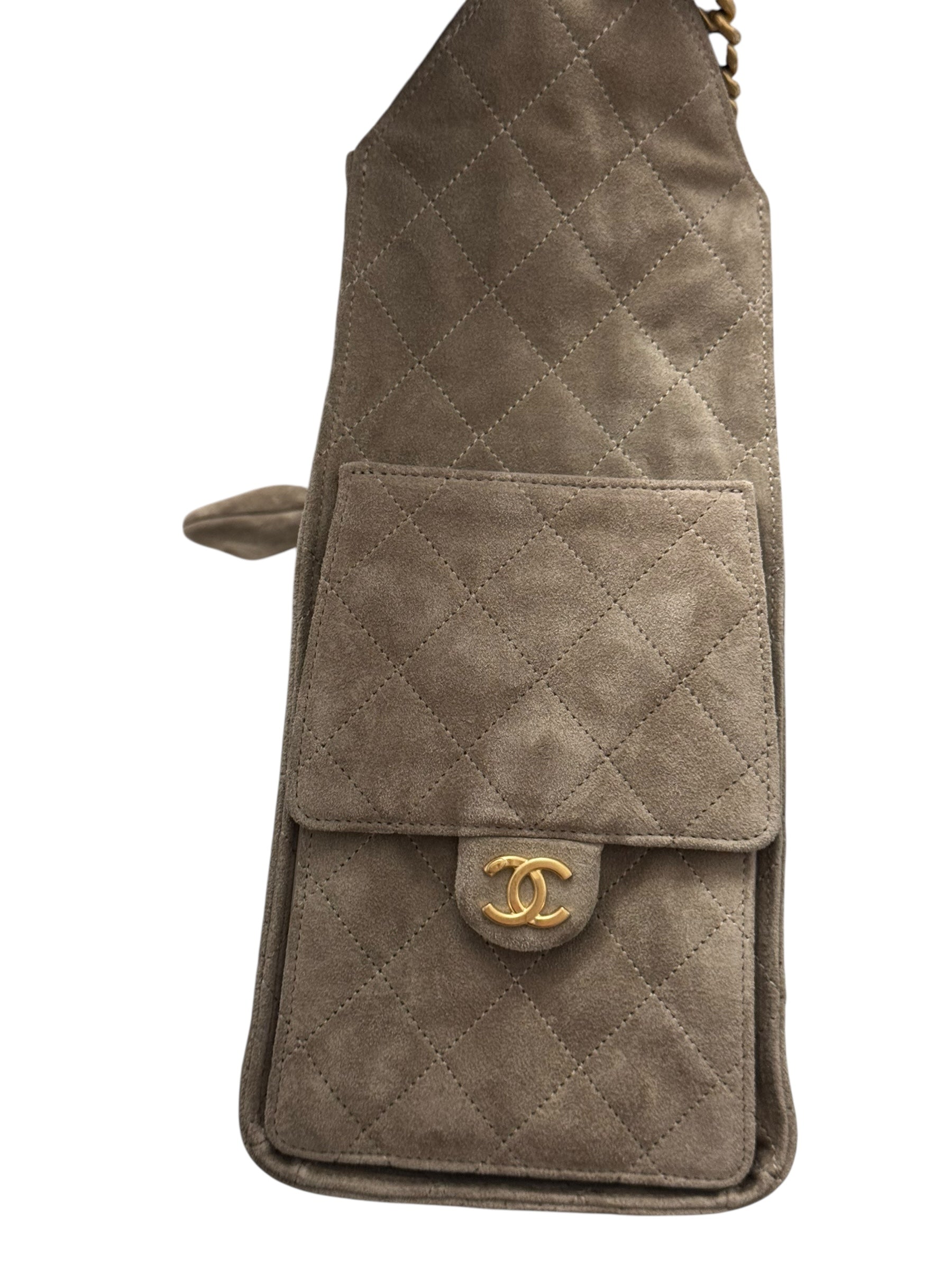 Quilted beige handbag with gold CC logo on a white background