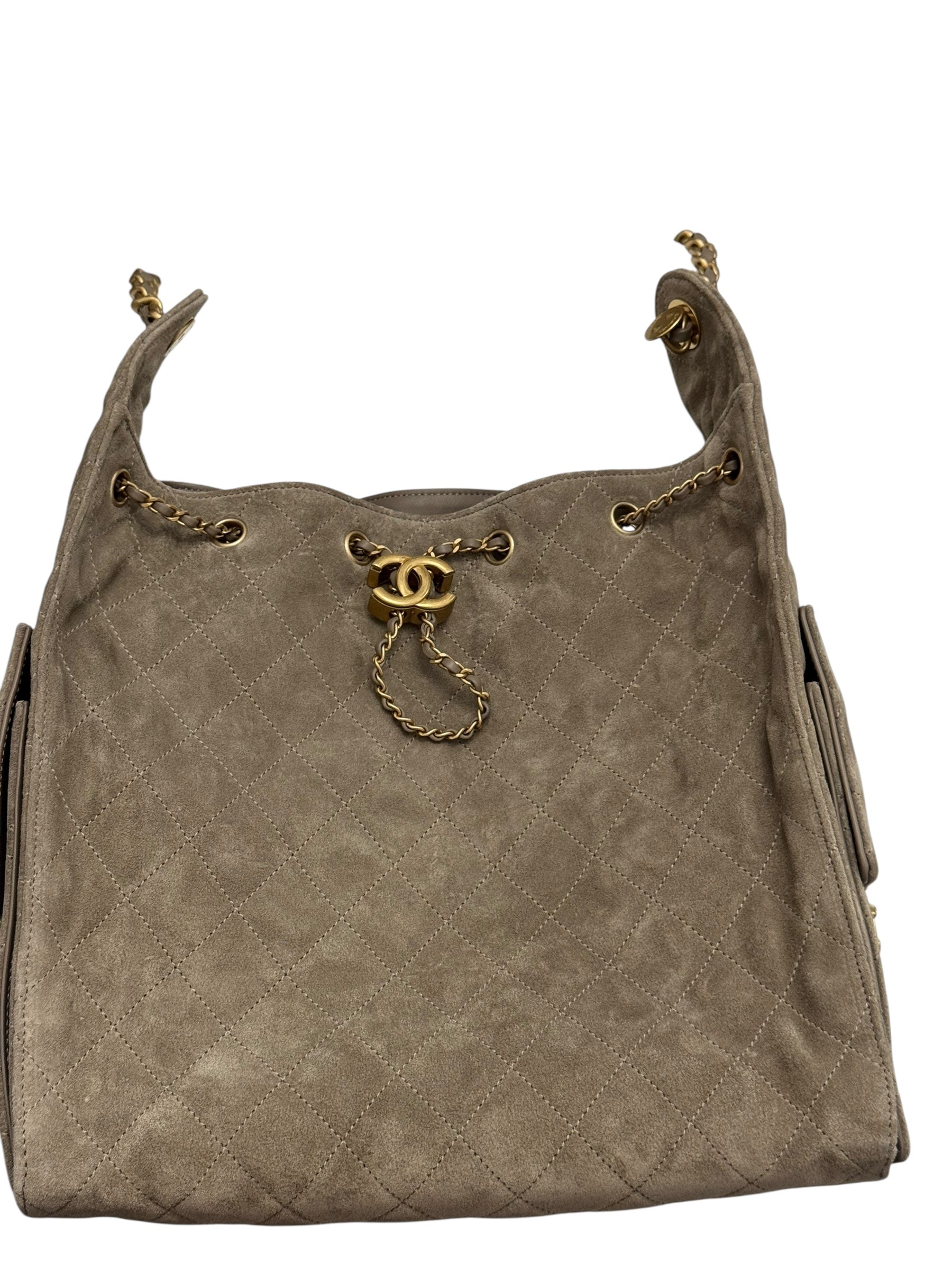 Brown handbag with gold chain and hardware on a white background