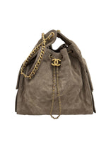 将图片加载到图库查看器，Brown suede handbag with gold chain and Chanel logo on a white background
