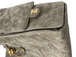 将图片加载到图库查看器，Gray quilted handbag with gold hardware on a white background
