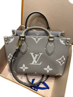 Load image into Gallery viewer, Louis Vuitton Onthego PM Dove/Cream Bicolor Monogram Empreinte Gold-tone Hardware
