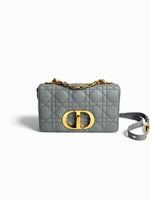 Load image into Gallery viewer, Gray quilted handbag with gold chain and logo on a white background
