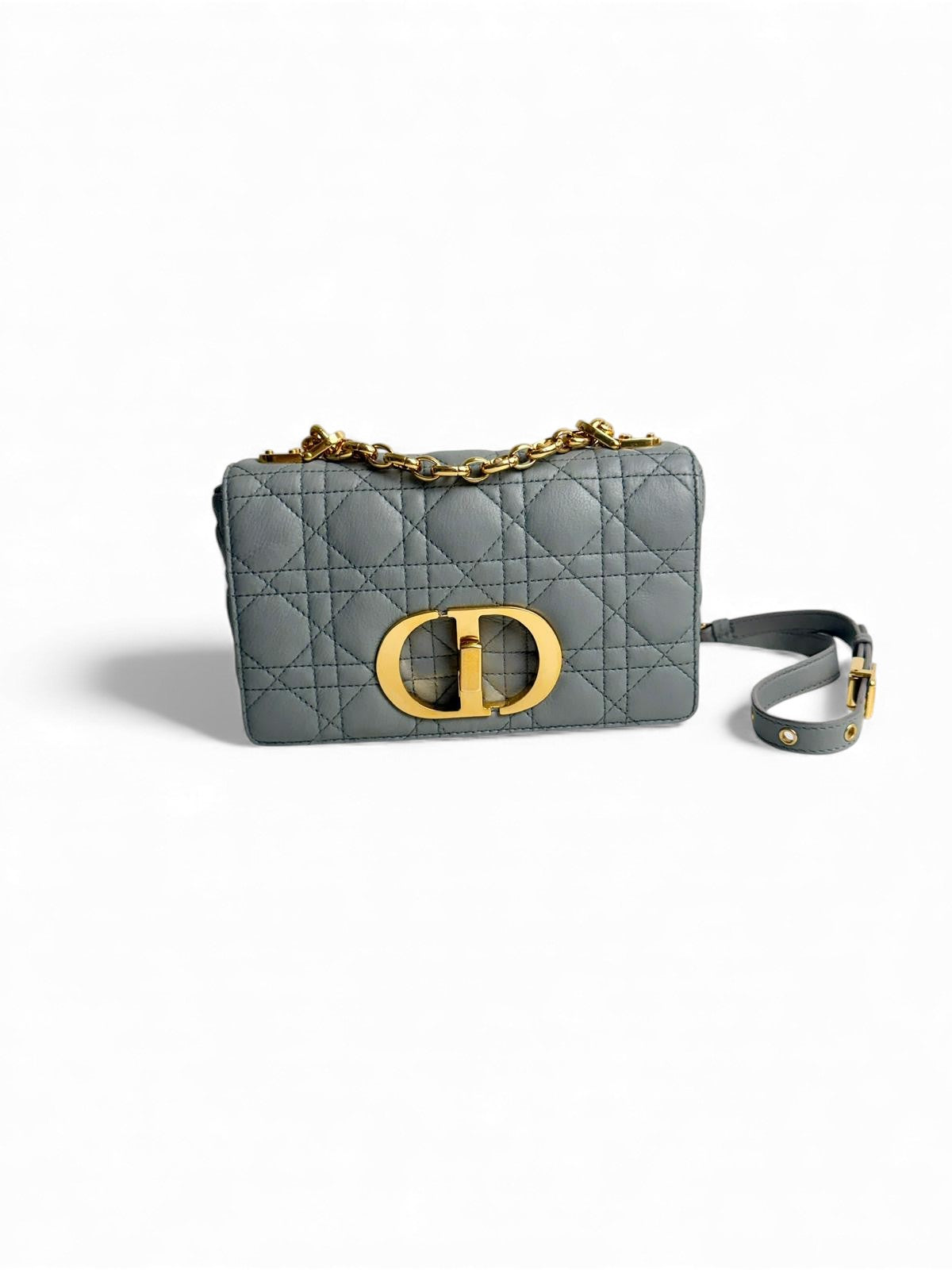Gray quilted handbag with gold logo on a white background