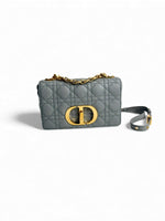 Load image into Gallery viewer, Gray quilted handbag with gold logo on a white background
