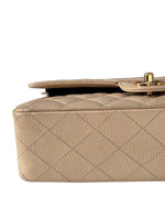 Load image into Gallery viewer, Beige quilted handbag with a gold clasp on a white background
