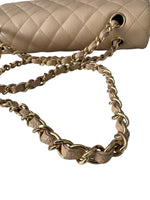 Load image into Gallery viewer, Beige quilted handbag with gold chain strap on a white background

