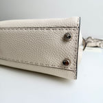 将图片加载到图库查看器，Close-up of a beige leather wallet with metal accents on a light gray background

