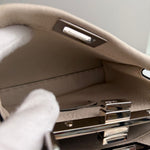 将图片加载到图库查看器，Close-up of a car&#39;s interior door panel with a hand reaching towards the handle.
