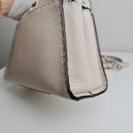 将图片加载到图库查看器，Beige handbag with textured surface on a light background
