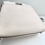将图片加载到图库查看器，Close-up of a textured white handbag on a light gray background
