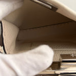 将图片加载到图库查看器，Close-up of a car door panel with leather texture and metallic handle.
