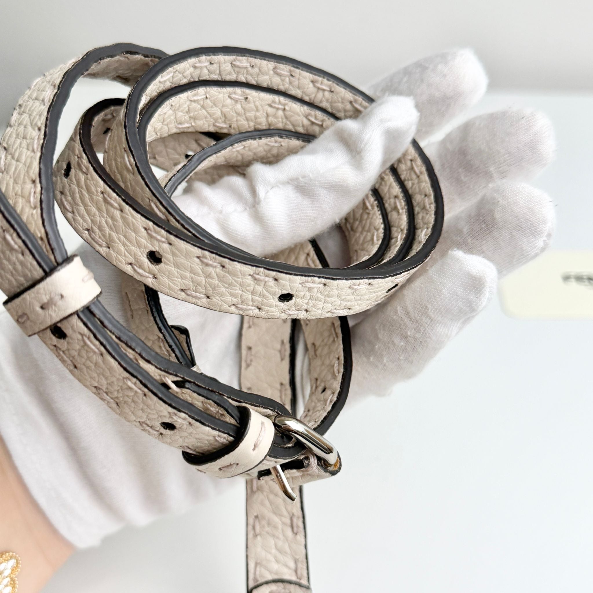 Leather dog leash with crocodile texture on a white background