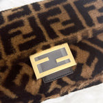 将图片加载到图库查看器，Gold and black Fendi logo on a patterned fabric background
