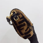 将图片加载到图库查看器，Brown fur pouch with gold clasp held by a gloved hand on a light gray background
