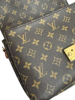 Load image into Gallery viewer, Close-up of a Louis Vuitton handbag with monogram pattern
