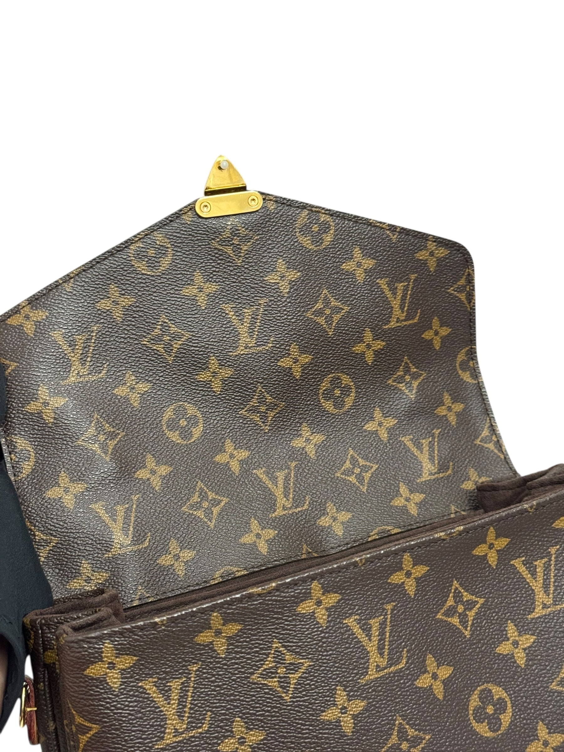Brown Louis Vuitton monogram handbag with gold hardware on a white background