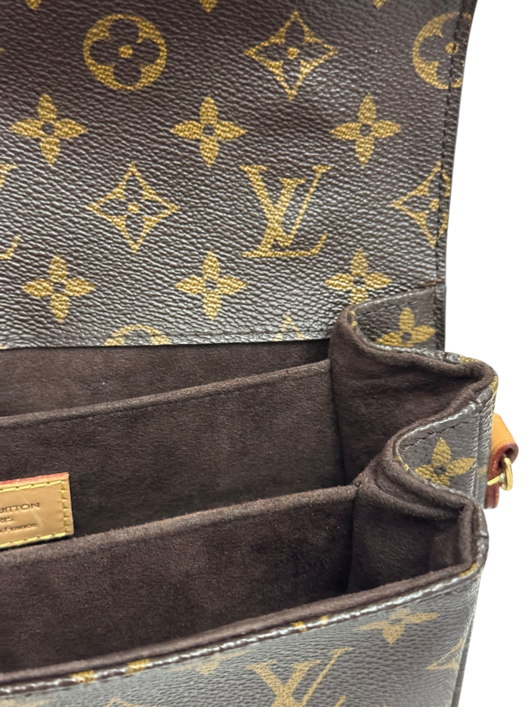 Close-up of a Louis Vuitton handbag with monogram pattern