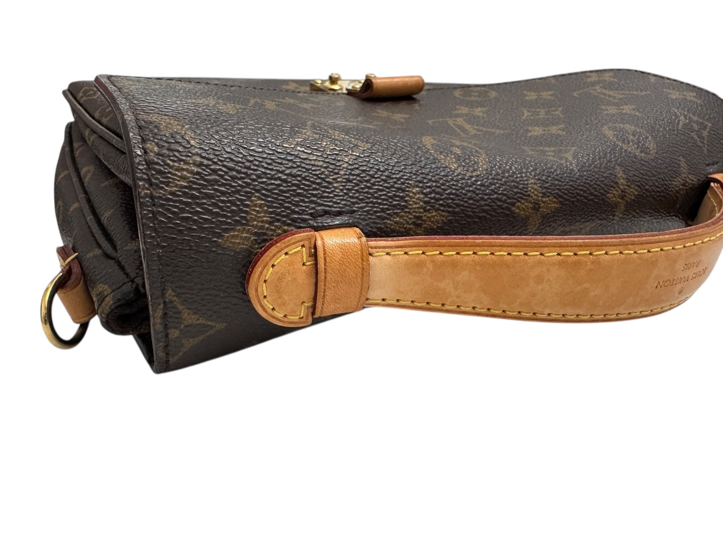 Designer handbag with brown leather strap on a white background