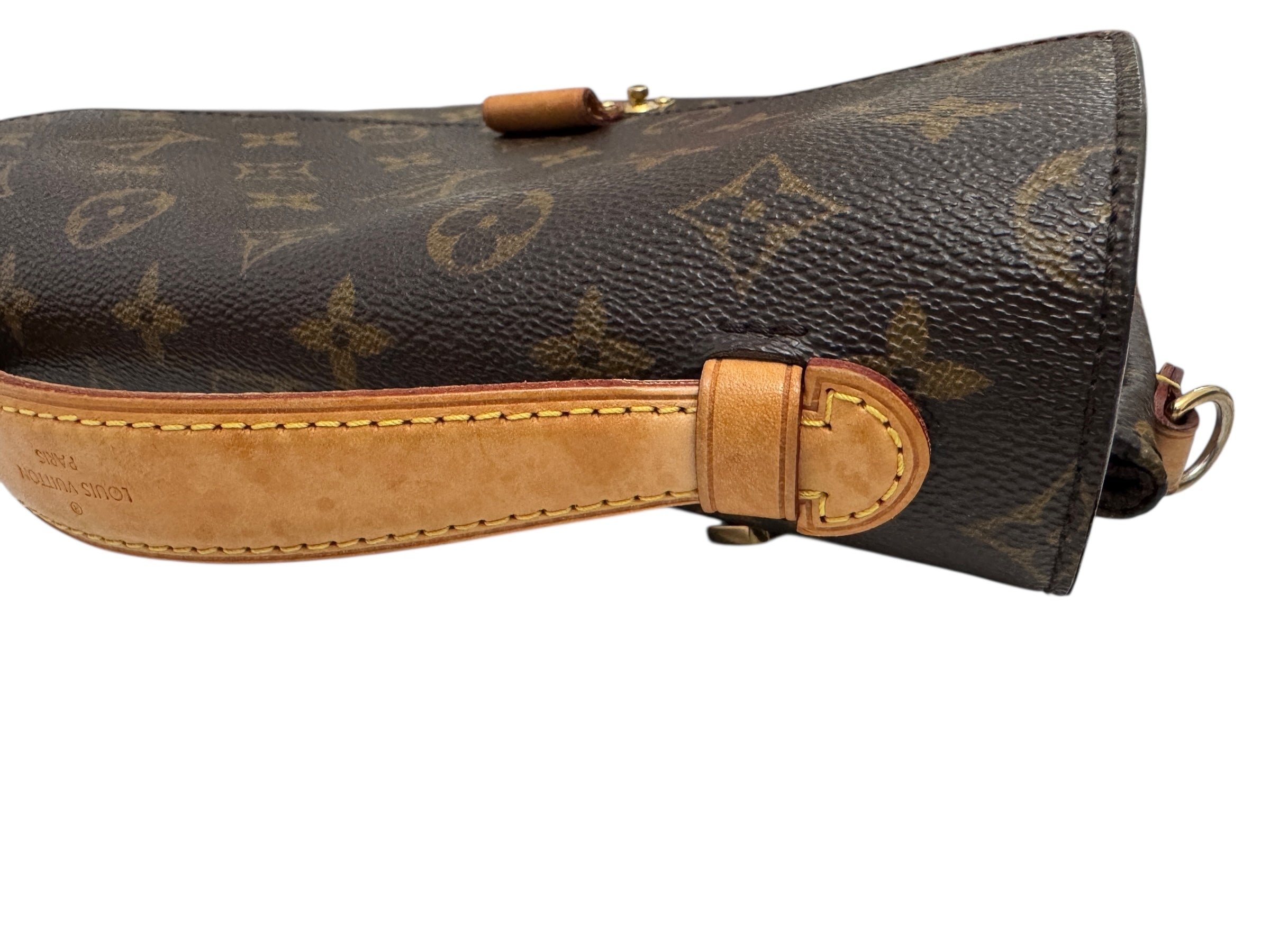 Designer handbag with monogram pattern on a white background