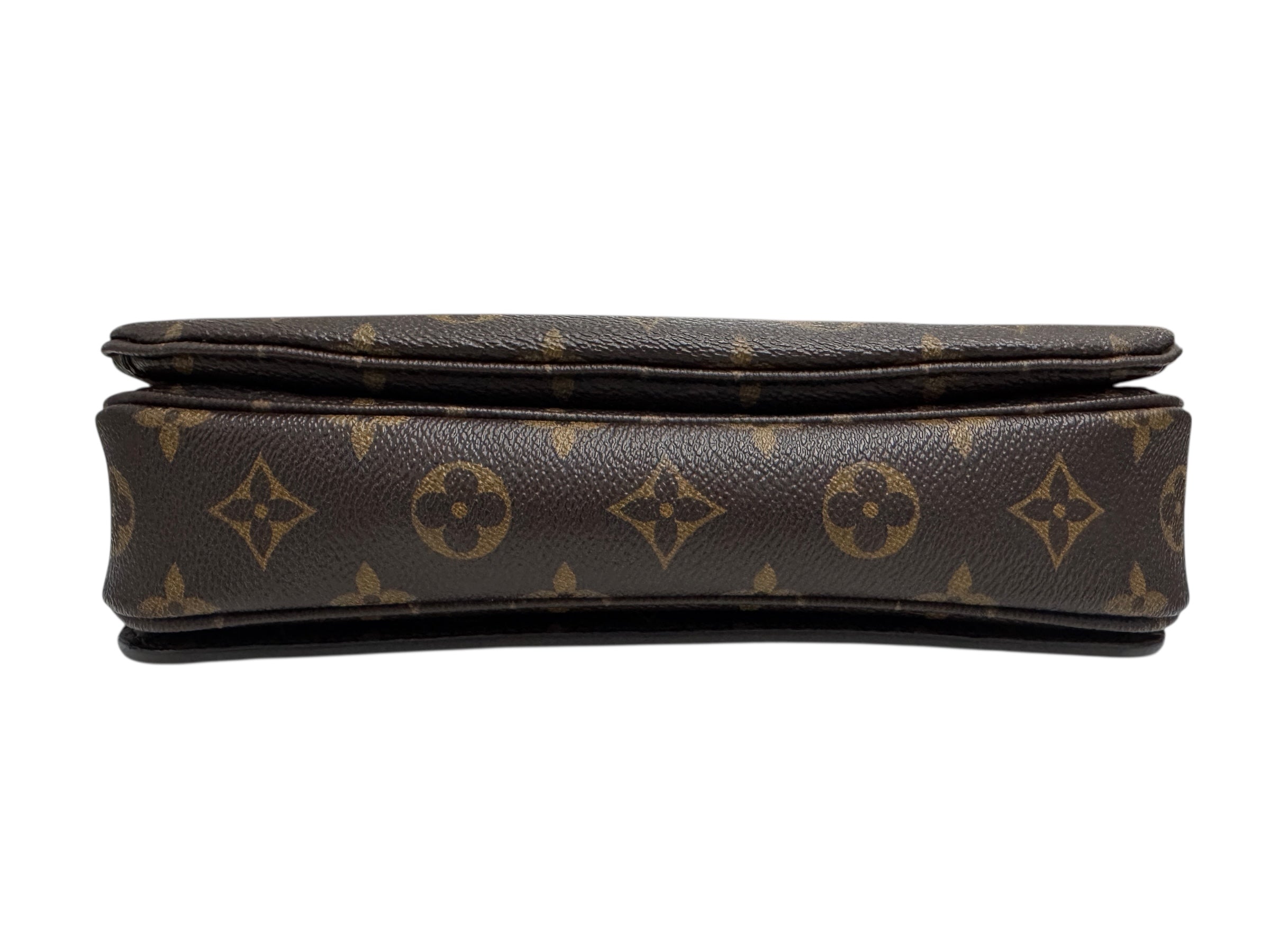 Designer handbag with monogram pattern on a white background