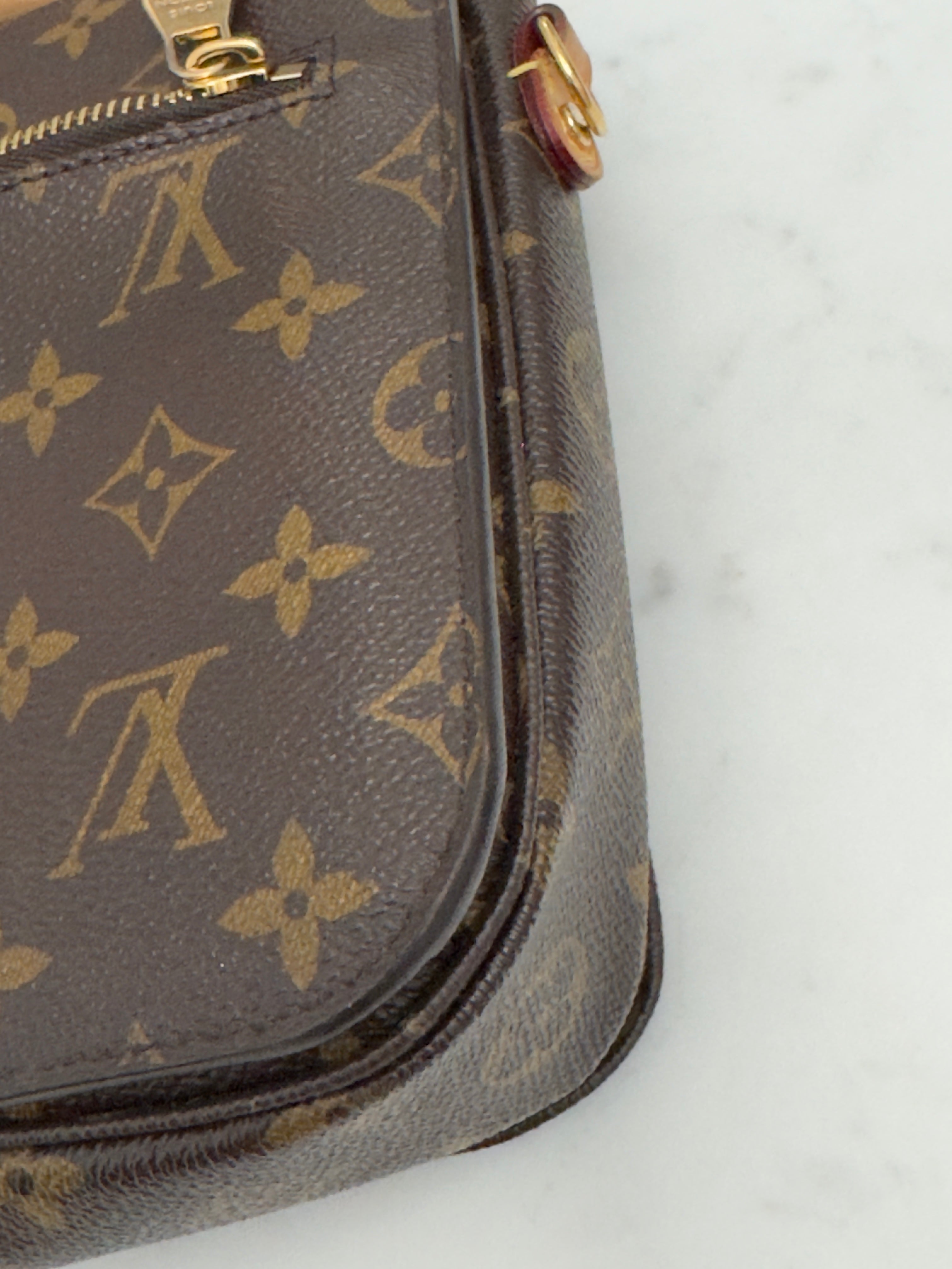 Louis Vuitton monogram handbag on a white background